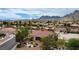 Aerial view of the community showcasing the rooflines of neighboring homes with desert landscaping and mountain backdrop at 2524 Banora Point Dr, Las Vegas, NV 89134