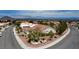 Expansive aerial shot showcases this home's location with mountain views and landscaped surroundings in a residential neighborhood at 2524 Banora Point Dr, Las Vegas, NV 89134