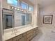 Bathroom features double sinks, bathtub, and clerestory windows for natural light at 2524 Banora Point Dr, Las Vegas, NV 89134