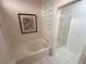 Bathroom with soaking tub, glass block window, and separate shower stall at 2524 Banora Point Dr, Las Vegas, NV 89134