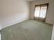 Bedroom features carpet and a large window at 2524 Banora Point Dr, Las Vegas, NV 89134