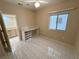 Bedroom with tiled floors and built-in desk near a window at 2524 Banora Point Dr, Las Vegas, NV 89134