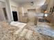 Functional kitchen with granite countertops, light wood cabinets and a double sink, perfect for everyday cooking at 2524 Banora Point Dr, Las Vegas, NV 89134