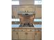 Well-maintained kitchen with light wood cabinets, stone countertops, gas cooktop and backsplash at 2524 Banora Point Dr, Las Vegas, NV 89134