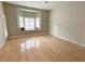 Living room featuring hardwood floors, a bay window, and a glass door at 2524 Banora Point Dr, Las Vegas, NV 89134