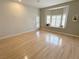 Living room featuring hardwood floors, a bay window, and a glass door at 2524 Banora Point Dr, Las Vegas, NV 89134