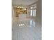 Open living space with tile floors and view of kitchen with breakfast bar at 2524 Banora Point Dr, Las Vegas, NV 89134