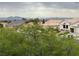 Scenic view from property showcasing nearby houses, desert landscaping, and mountain range backdrop at 2524 Banora Point Dr, Las Vegas, NV 89134