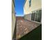 View of a house with a private backyard featuring a brick-paved patio for relaxation and enjoyment at 2713 Abrantes Pl, Henderson, NV 89044