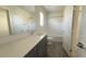Bright bathroom with a large mirror, a spacious dark vanity, and a shower-tub combination at 2713 Abrantes Pl, Henderson, NV 89044