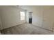 Carpeted bedroom with neutral walls, natural light, and ensuite bathroom at 2713 Abrantes Pl, Henderson, NV 89044