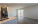 Open concept living space from kitchen with sliding door to patio at 2713 Abrantes Pl, Henderson, NV 89044