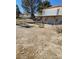 View of a backyard with mature trees from the upper porch at 2784 Belcastro St, Las Vegas, NV 89117