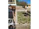 Lawn with concrete features in a backyard with steps leading to the house at 2784 Belcastro St, Las Vegas, NV 89117