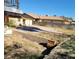 Overgrown backyard space, offering potential for landscaping and personalization at 2784 Belcastro St, Las Vegas, NV 89117
