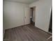 Bedroom features new gray flooring and easy access to the bathroom at 2784 Belcastro St, Las Vegas, NV 89117