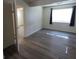 Bright bedroom features new gray flooring, a window, and closet at 2784 Belcastro St, Las Vegas, NV 89117
