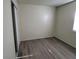 Bedroom features new gray flooring, a window, and closet at 2784 Belcastro St, Las Vegas, NV 89117