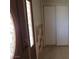 Entryway with door, tiled accent wall and sliding closet at 2784 Belcastro St, Las Vegas, NV 89117