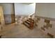 Inviting entryway showcasing tiled walls and a carpeted staircase at 2784 Belcastro St, Las Vegas, NV 89117