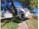 Two-story home with mature trees and lawn area, needs some TLC but has potential at 2784 Belcastro St, Las Vegas, NV 89117