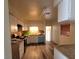 Bright kitchen featuring white cabinets, laminate countertop, and updated appliances at 2784 Belcastro St, Las Vegas, NV 89117