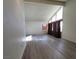 Bright living room featuring new laminate floors, high ceilings, and large windows at 2784 Belcastro St, Las Vegas, NV 89117
