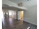 Open-concept living room features new gray flooring, modern light fixture, and closet access at 2784 Belcastro St, Las Vegas, NV 89117