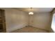 Neutral living room with tile floors and a decorative light fixture at 2784 Belcastro St, Las Vegas, NV 89117