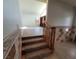 Staircase leading up to the living room with laminate floor and vaulted ceiling at 2784 Belcastro St, Las Vegas, NV 89117