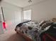 Relaxing bedroom featuring a bright window, closet, and cozy bed with fun gaming themed bedding at 302 Bay Village Pl, Henderson, NV 89011