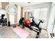 Light exercise room with various workout equipment and mirrored wall; ideal for home fitness at 302 Bay Village Pl, Henderson, NV 89011