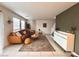 Open living room with large windows, a patterned rug, modern furniture, and sleek decor at 302 Bay Village Pl, Henderson, NV 89011