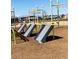 Fun playground with various recreational equipment and soft ground for safe playing at 302 Bay Village Pl, Henderson, NV 89011