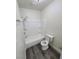 Clean bathroom with a white tub/shower combination and gray vinyl flooring at 3412 Townhouse Dr, Las Vegas, NV 89121