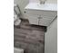 A clean and simple bathroom vanity with gray vinyl flooring at 3412 Townhouse Dr, Las Vegas, NV 89121