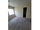 Inviting carpeted bedroom with a doorway and window, offering a peaceful and private space at 3412 Townhouse Dr, Las Vegas, NV 89121