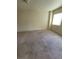 Expansive carpeted bedroom bathed in natural light, creating a serene and airy ambiance at 3412 Townhouse Dr, Las Vegas, NV 89121