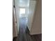 A bedroom with wood laminate flooring and a large window allowing for plenty of natural light at 3412 Townhouse Dr, Las Vegas, NV 89121