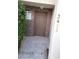 Inviting entryway with a classic brick facade and a well-maintained front door at 3412 Townhouse Dr, Las Vegas, NV 89121
