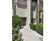Exterior view of a well-maintained condo with fresh landscaping in front at 3412 Townhouse Dr, Las Vegas, NV 89121