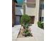 Exterior view of a well-maintained condo with fresh landscaping in front at 3412 Townhouse Dr, Las Vegas, NV 89121