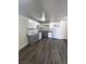 Well-lit kitchen featuring gray counters, gray lower cabinets, and white upper cabinets at 3412 Townhouse Dr, Las Vegas, NV 89121