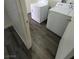 Laundry room with vinyl flooring and modern washer and dryer appliances at 3412 Townhouse Dr, Las Vegas, NV 89121