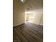 Inviting living room featuring modern gray wood-look flooring at 3412 Townhouse Dr, Las Vegas, NV 89121