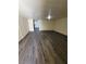 A very large living room with wood laminate flooring at 3412 Townhouse Dr, Las Vegas, NV 89121
