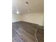 A large living room with wood laminate flooring and neutral-colored walls at 3412 Townhouse Dr, Las Vegas, NV 89121