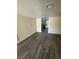 Open living area with modern gray wood-look floors and recessed lighting at 3412 Townhouse Dr, Las Vegas, NV 89121