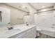 Bathroom with double vanity, mirror, towel rack, toilet, and a shower-tub at 3437 Visionary Bay Ave, North Las Vegas, NV 89081