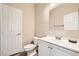 A bright bathroom featuring a single sink vanity and a large mirror at 3437 Visionary Bay Ave, North Las Vegas, NV 89081